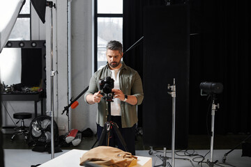 Creative professional capturing images in a well equipped studio during a photoshoot