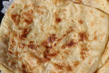 A close-up of the traditional Moroccan flatbread known as Msemmen or Msemen