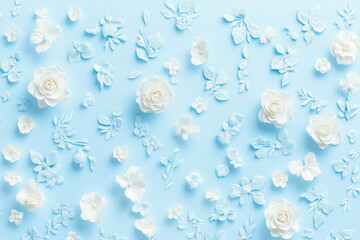 White and blue floral pattern with roses on light blue background