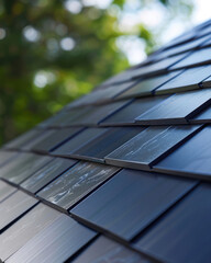 A close-up of innovative solar shingles, showcasing their sleek design and energy efficiency in a modern roof setup
