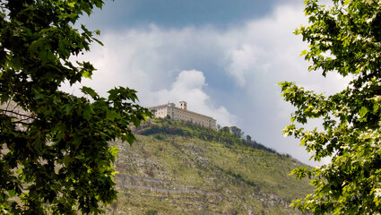Montecassino Abbey rising on the hilltop under cloudy sky