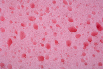 Close up of a pink sponge, sponge background