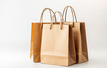 Three brown paper shopping bags on white background