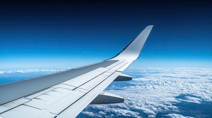Fototapeta premium A side view of an airplane wing in motion, with the open sky and distant horizon representing the vast journey of international flights.
