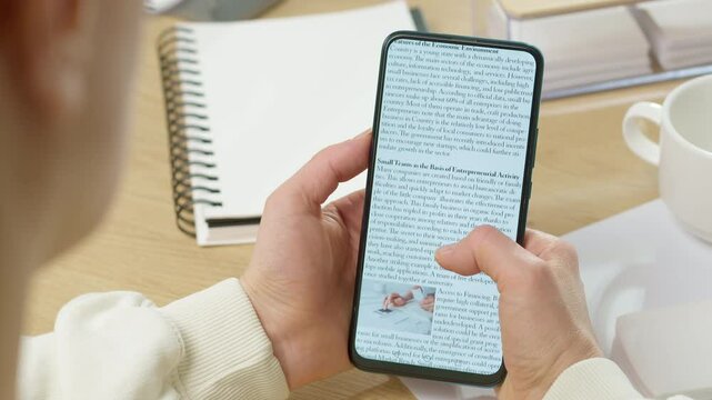 Woman watching and reading news on phone screen. Information and press concept.