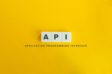 Application Programming Interface, API. Block Letter Tiles on Flat Background. Minimalist...