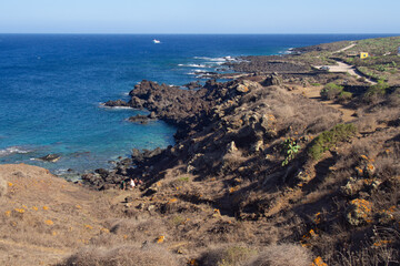 Volcanic coastline of Linosa, Sicily – rugged rocks and turquoise waters