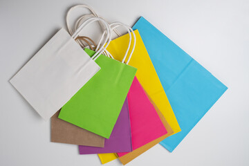 Color paper bag on a light background. Delivery and shopping concept. Packaging template mockup 