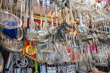 Diverse collection of kitchen utensils hanging display