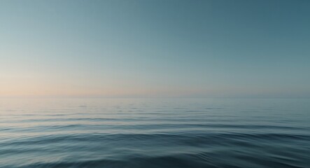 Obraz premium The ocean is dark blue and the water is calm.