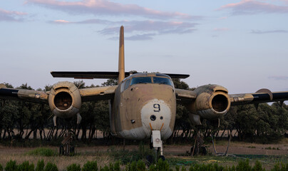 Old canadian military plane on the field. Historical vehicle