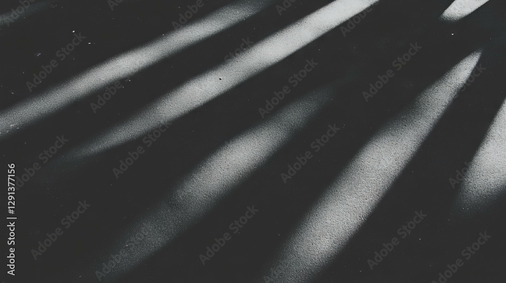 Poster dramatic light and shadow patterns on matte concrete surface