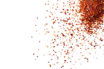 Top view of spicy red chili pepper flakes scattered on transparent or white background