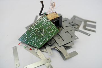 Disassembled Power Supply Transformer with Metal Parts and Wires