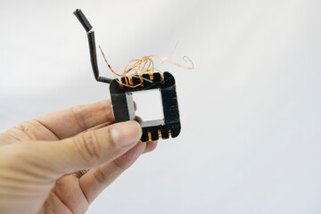 Disassembled Power Supply Transformer with Metal Parts and Wires
