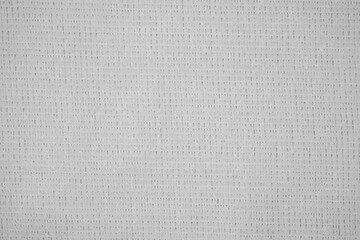 Textile close up of light grey fabric, fabric texture as a background.