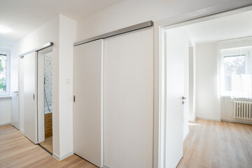 Modern interior design featuring sliding doors and empty rooms