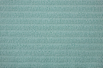 Textile close up of a green  fabric, fabric texture as a background.