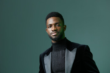 Confident african american man in stylish black turtleneck and suit exuding elegance and...