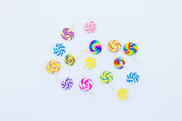 Sweet food lollipop on white background, Set of colorful lollipops isolated on white background, Colorful lollipops swirls, Spiral multicolor candy on white background, Top view