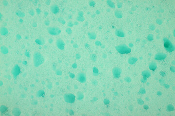 Close up of a mint sponge, sponge texture as a background.