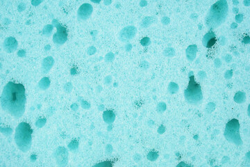 Close up of a blue sponge, sponge texture as a background.