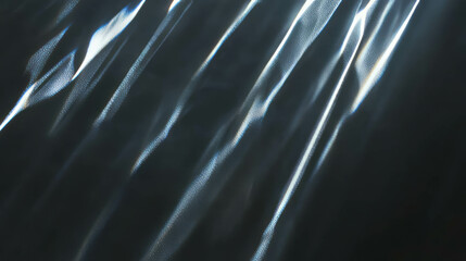 Sunlight reflection on metallic surface creating abstract light patterns for creative background design