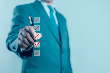 Business Performance Checklist Businessman Using Laptop Doing Online Checklist Survey On Computer...