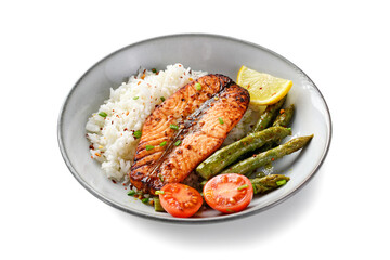Baked salmon fish steak with asparagus fried rice and lemon slice. Delicious lunch or dinner for every day. Isolated on white  background