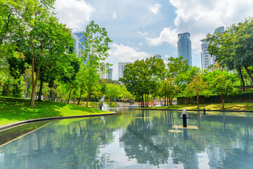 Scenic artificial lake in a green city park, Kuala Lumpur