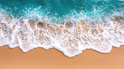 Coastal waves crashing on golden sand, turquoise ocean background, overhead view