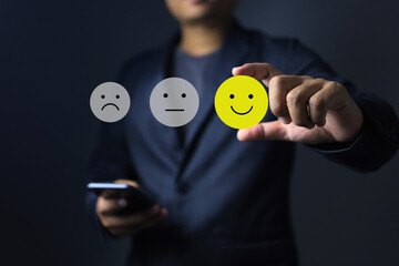 Evaluation choice on businessman using smart phone to evaluate products or customer experience feed...