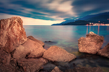 Gloomy summer view of Potam Public beach. Dramatic morning seascape of Adriatic sea. Stunning  cityscape of Himare town, Albania, Europe. Traveling concept background.