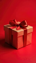 Fototapeta premium Gift box with crimson ribbon tied around it on a red background, holiday gift, crimson ribbon, gift box