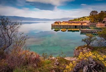 Selbstklebende Fototapeten Blooming shore of Ohrid lake. Attractive morning scene of popular tourist destination - Bay of Bones. Marvelous  landscape of North Macedonia, Europe. Traveling concept background. © Andrew Mayovskyy