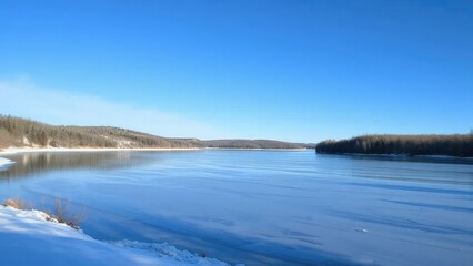 Fototapeta premium A serene lake in winter with surrounding trees and a blue sky, frozen lake, serene lake