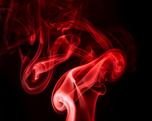 Obraz premium A mysterious atmosphere is created by the swirling, bright red smoke on a black background. Perfect for themes of energy, intrigue, or art. The composition emphasizes the flowing motion of the smoke