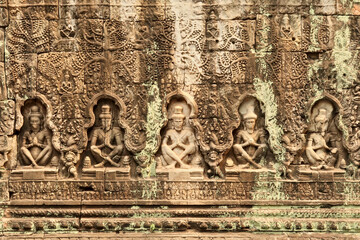 Elaborate bas relief, bas-relief carved into the sandstone at the Prasat Preah Khan Temple, five seated monks in a row, praying, Angkor Wat, Siem Reap, Cambodia