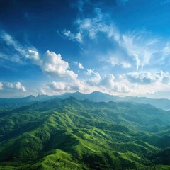 Lush Green Mountain Range Under a Vibrant Blue Sky