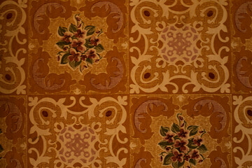background from old brown oilcloth with a square pattern