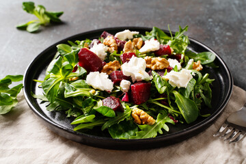 Fresh salad with beetroot, arugula and cheese