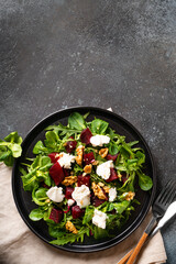 Fresh salad with beetroot, arugula and cheese