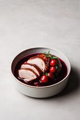 Tender sliced chicken served in rich berry sauce garnished with