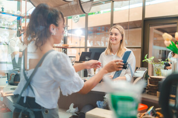 Payment Experience at Cafes, Woman Paying for Her Meal with Credit Card, Embracing Technology and Online Services for Convenient Transactions, Enhancing the Modern Business Lifestyle at Eatery