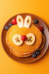 Cute pancake art resembling bunny, topped with fresh fruit and v