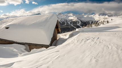 Snowshoeing to the Fevri malga on Mount Spinale. Easy snowshoe hike from Madonna di Campiglio (1h30/2h). Wonderful views of the Brenta Dolomites, Madonna di Campiglio, Trentino, Italy