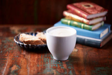 Cappuccino on dark wooden background. Soft focus. Close up.