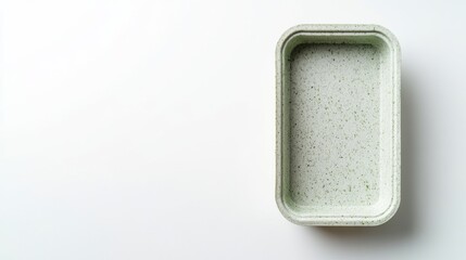 Eco-friendly rectangular biodegradable food container on white surface.