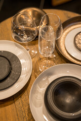 Close up on luxury italian tableware, dishes and glasses.