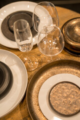 Close up on luxury italian tableware, dishes and glasses.